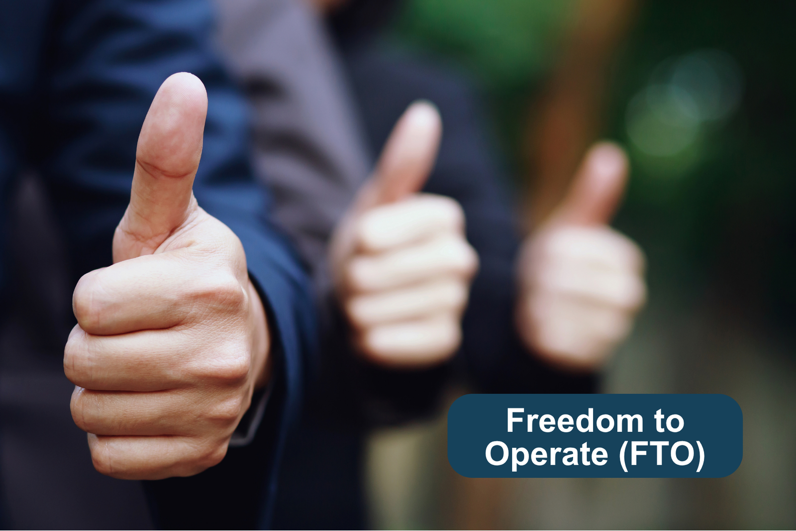A line of three people with thumbs up and a banner that says "Freedom to Operate (FTO)"